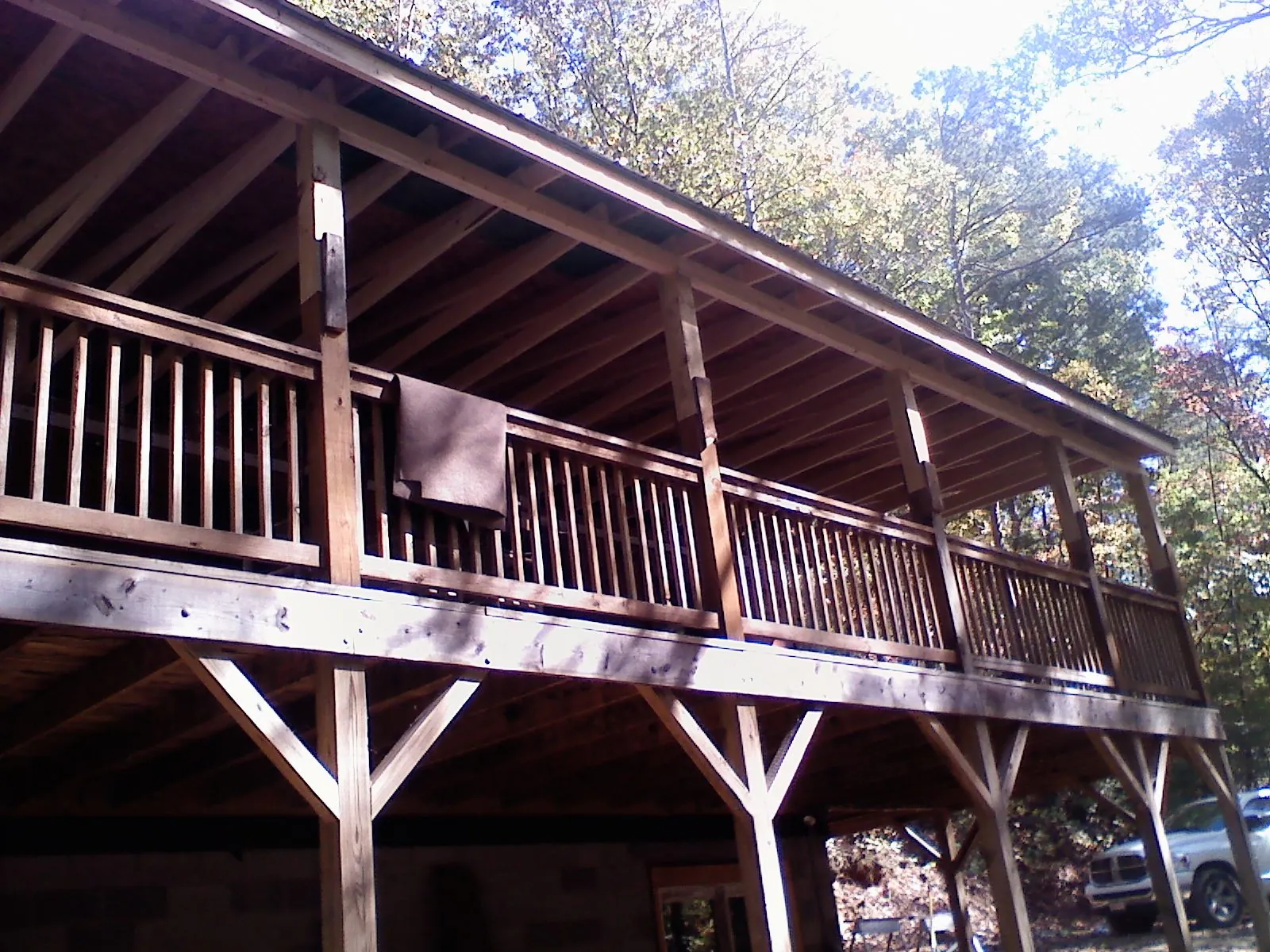 Timber framing under a new elevated porch and deck — Roof Leak Repair in Ellenburg Center by Roofing Brothers